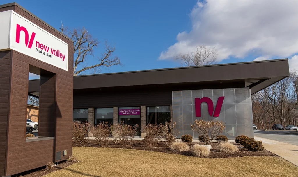 Outside the building of the New Valley Bank & Trust 16 Acres Branch